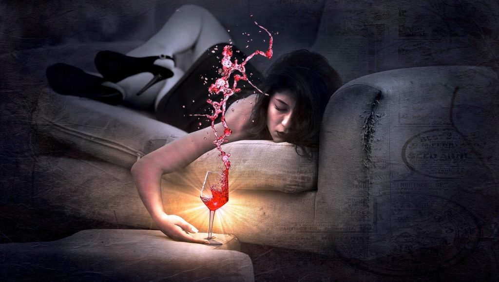 Girl Sleeping on Couch with Alcohol glass on table