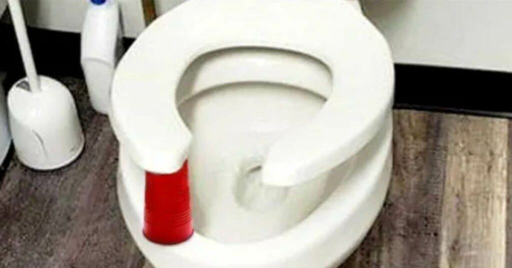 put red cup under toilet seat