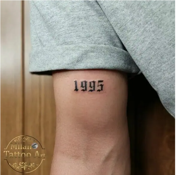 date tattoo on bicep