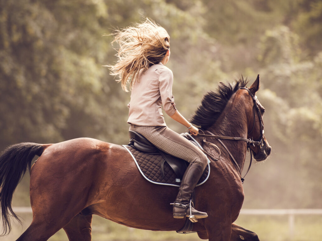 One of her favorite hobbies for women is horseback riding, and she can be seen happily riding a horse in the field.