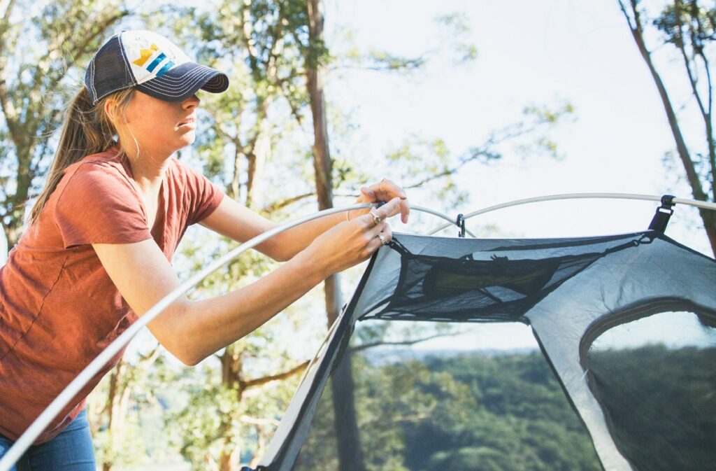 One of her favorite hobbies for women is camping, and she can be seen happily setting up a tent in the woods.